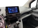 the interior of a car with a touch screen and steering controls