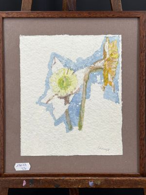 tableau représentant une jonquille, dans un cadre en bois, posé sur un chevalet