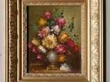 une photo d'un tableau de fleurs dans un cadre doré