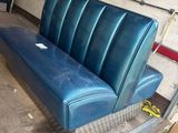 a couch that is sitting in the back of a truck