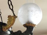a chandelier with a glass ball hanging from it