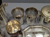 a lot of silver items that are on a table