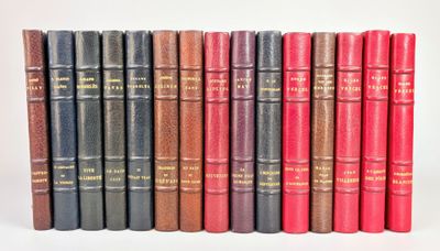 the books are lined up in a row on a white surface