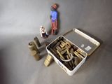 a small toy figure standing next to a box of tools