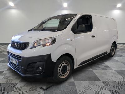 the white van is parked on a checkered floor in a room