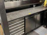 a kitchen with stainless steel appliances and counter tops
