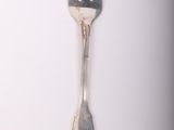 a silver fork and a silver spoon on a white surface