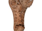 an image of a wooden corb with a face on it