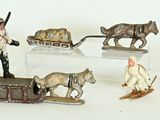 many figurines of people and animals on a table