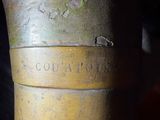 a close up view of a metal object with a tag on it