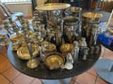a table with a lot of silver items on it