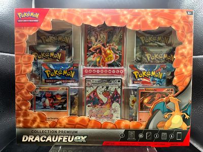 display case of pokemon trading cards in a display case on a table