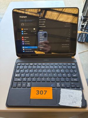 a laptop computer sitting on a table with a price tag on it