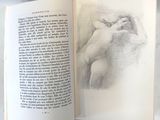 un livre sur lequel figure le dessin d'un nu