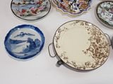 a lot of plates that are sitting on a table