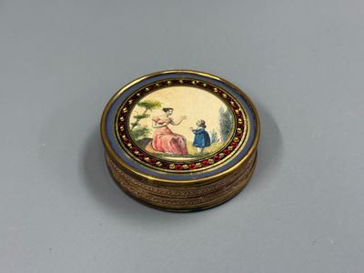 une image représentant une boîte dorée et bleue ornée d'une peinture