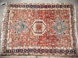 an old persian rug with a red and blue design on it