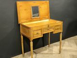 an old wooden desk with a mirror on top of it