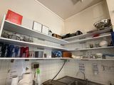 a kitchen with a sink and a stove in it