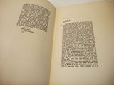 an open book with a page in it on a table