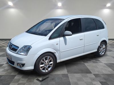a picture of a white minivan parked in a room