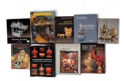 a lot of books that are sitting on a table