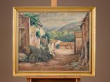 a painting on a easel with a painting of a village in the background