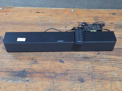 an image of a sound bar sitting on top of a wooden table