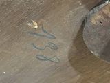 a close up of a piece of metal with some writing on it