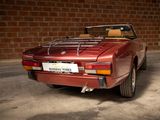 an image of a red sports car parked in a garage