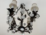 a chandelier hanging from the ceiling in a kitchen