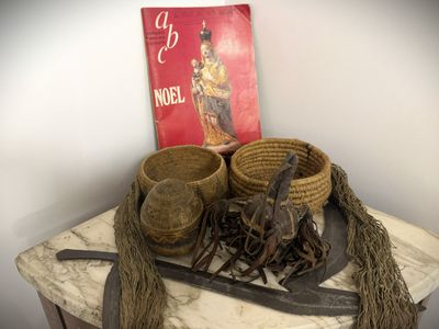 a table with a bunch of baskets and a book on it