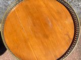 a close up of a wooden table with a metal frame on it