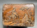 a wooden box with a picture of a man riding a horse