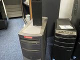 a desktop computer sitting on top of a desk next to a printer