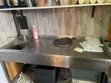 a kitchen with a sink and a stove in it