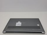 a laptop that has a sticker on the back of it