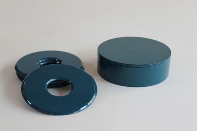 a blue container with a ring on top of it