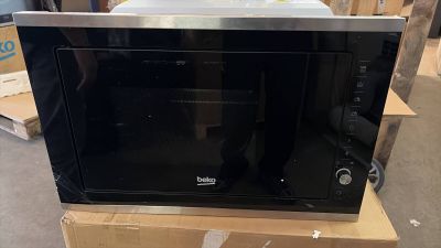 a microwave that is sitting on top of a box