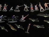 a lot of figurines that are sitting on a table