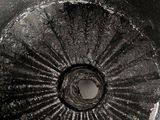 a close up of a metal object with a hole in it