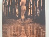 an old photo of a nude woman standing in the water