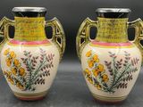 two vases sitting side by side on a table