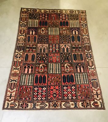 an old rug with many different colors and patterns