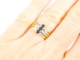 a woman ' s hand with a ring on it and a ring on her finger