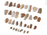 several pieces of stone are arranged in a circle on a white surface