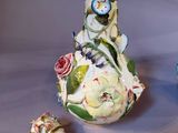 two vases that have been decorated with flowers on them