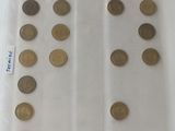 a lot of coins in a plastic bag on the table