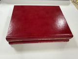 a red book sitting on top of a white table
