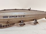 a small model of an air plane on a white surface